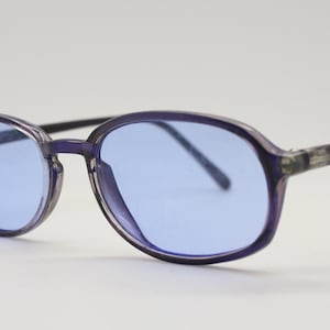 90s vintage vibrant blue sunglasses. NOS slim minimal indigo oval frame with sky blue lenses. BNWT. 2000s. 00s rave