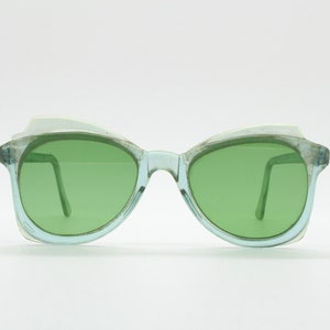 Vintage 40s abstract cat eye sunglasses made in England. Womens exquisite transparent green lucite cateye frame with darker lenses. 50s