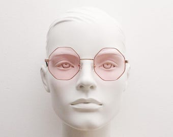 90s vintage octagon sunglasses. Gold 8 sided 60s design glasses with minimal slim frame and light pink lenses. NOS hexagon
