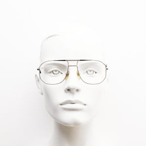 70s vintage angular square aviator eye glasses made in Italy. Stylised gold chrome optical frames with purple feature details. Prescription