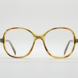70s vintage round eye glasses. Tasteful transparent acetate optical frame in mottled brown tones. Prescription eyeglasses. RX Spectacles