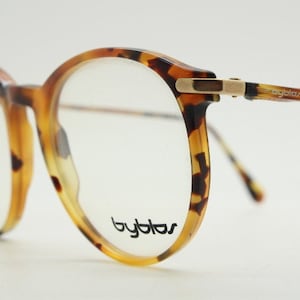 Byblos 80s vintage round glasses model 7039 made in Italy. Vibrant amber tortoise acetate optical frame. Prescription eyeglasses. Spectacles