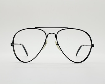 70s vintage teardrop aviator eye glasses in plain black satin. Straightforward perfected  dimensions. Prescription optical frames. 80s. NOS