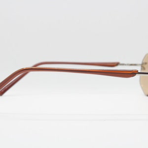 Y2K vintage sunglasses. Frameless light brown bevelled edge lenses with chrome connectors and slender arms. 2000s unused NOS. BNWT image 7
