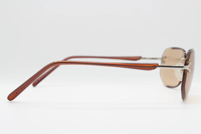 Y2K vintage sunglasses. Frameless light brown bevelled edge lenses with chrome connectors and slender arms. 2000s unused NOS. BNWT image 7