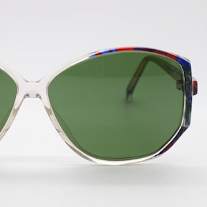 80s vintage hexagon sunglasses. Dynamic blue marbled and transparent frame with green lenses. 70s style NOS