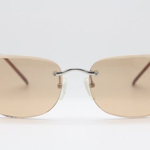 Y2K vintage sunglasses. Frameless light brown bevelled edge lenses with chrome connectors and slender arms. 2000s unused NOS. BNWT image 5