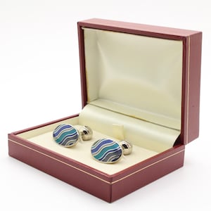 Charles Tyrwhitt vintage oval cuff links made in England. Solid metal construction with enamel waved pattern in blue tones. NOS