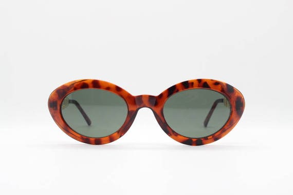 90s vintage cateye sunglasses. Womens oval tortoi… - image 3