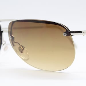 90s vintage modified aviator sunglasses. Metal half frame with brown graduated cutaway lenses. Mens aviators. Unused NOS
