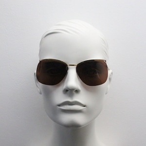 Vintage 50s lightweight sunglasses. Minimal curved floating lens design on a flat brow bar. 40s. NOS