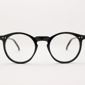 Black round Y2K glasses. 40s, 50s style optical frames with clear lenses. Prescription eyeglasses. O Malley spectacles