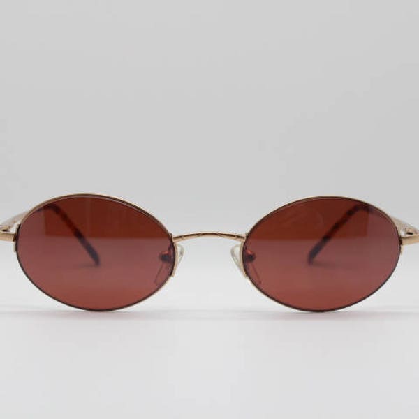 90's vintage oval sunglasses. Matt satin gold metal frame with brown lenses. BNWT. Unused NOS