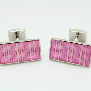 Vintage rectangular cuff links made in England by Herringbone. Solid metal construction with fine striped enamelled pink tones. NOS