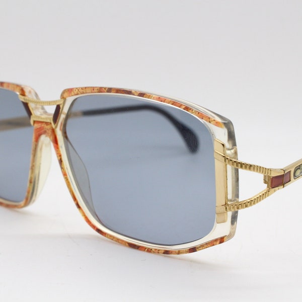 Cazal 80s vintage rectangular sunglasses. Characteristic outstanding design of abstract multi colour frame with golden arms