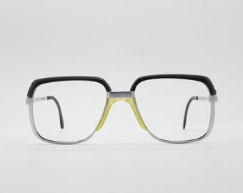 Rodenstock 60s vintage mens square eye glasses. Satin and chrome finish optical frame with black brows in perfect proportions. Prescription