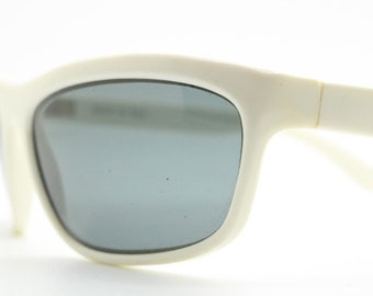 Linda Farrow 80s vintage sunglasses made in Italy. Ice white wraparound sporty frame with dark lenses. Luxe Gallery Projects. NOS