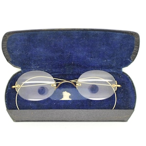 Bausch & Lomb Victorian vintage antique oval eye glasses. 1800s gold metal bridge with coiled wire arms. Civil War RX optical spectacles