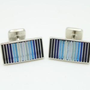 Vintage rectangular cuff links made in England by Herringbone. Solid metal construction with fine striped enamel blue tones. NOS