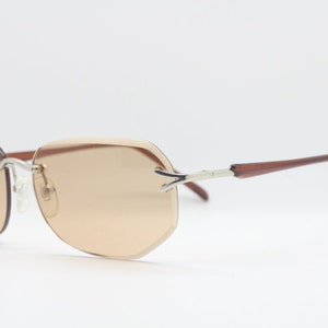 Y2K vintage sunglasses. Frameless light brown bevelled edge lenses with chrome connectors and slender arms. 2000s unused NOS. BNWT image 6