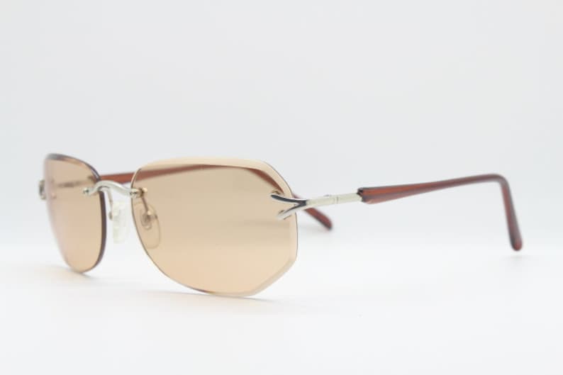 Y2K vintage sunglasses. Frameless light brown bevelled edge lenses with chrome connectors and slender arms. 2000s unused NOS. BNWT image 6