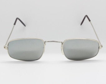 90's vintage rectangular sunglasses. Slim silver metal 60's style frame with matching mirror lenses. BNWT. Unused NOS