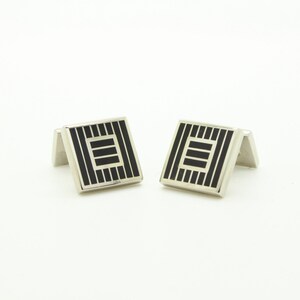 Aquascutum vintage square cuff links made in England. Solid metal construction with in silver and black stripes and blocks. NOS
