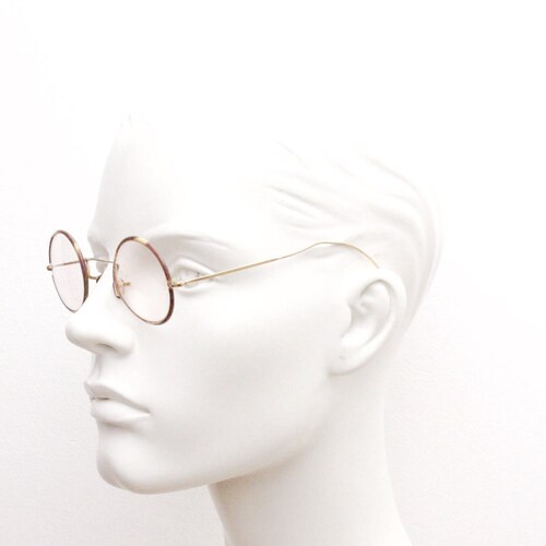 20s, shops 30s vintage glasses. Tortoise lens surrounds on a gold Windsor optical frame with coiled arms. Prescription eyeglasses. RX spectacles