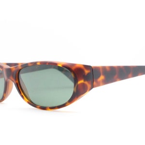 90s vintage sunglasses. Matt tortoise curved 60s style wraparound frame with green lenses. BNWT. Unused NOS