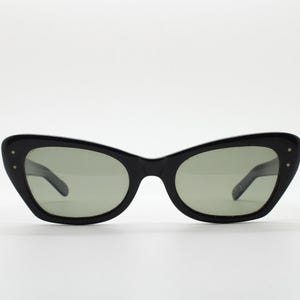 60s vintage cat eye sunglasses by Polaroid made in the UK. Womens lethal black cateye frame with convex lenses. 50s rockabilly pin up