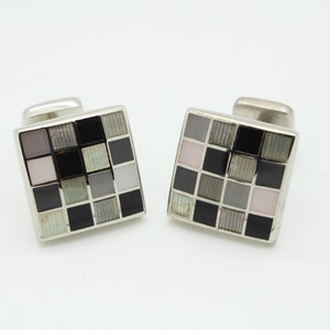 Vintage square cuff links made in England by Herringbone. Solid metal construction in grey, black and white check. NOS