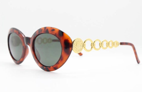 90s vintage cateye sunglasses. Womens oval tortoi… - image 1