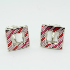 Vintage striped square cuff links made in England by Herringbone. Solid metal construction with cut out centre in pink and red enamel. NOS