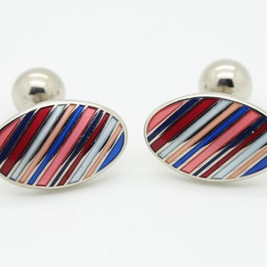 90s vintage oval cuff links made in England. Solid metal construction with multi colour enamelled diagonal stripes. NOS
