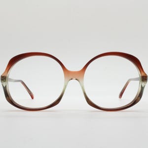 70s vintage round eye glasses. Womens mottled brown and crystal acetate optical frame in tasteful proportions. Prescription spectacles. NOS