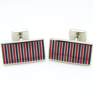 Vintage rectangular cuff links made in England by Herringbone. Solid metal construction with fine blue and red striped enamel. NOS