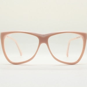 80s vintage eye glasses by Opti Lunettes. Dramatic ultra fashion angular optical frame in pink layered acetate. Prescription RX NOS