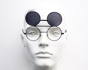 Les enfants ronds des années 90 retournent des lunettes de soleil. Lentille transparente à monture en métal noir double palme. Enfants. Adolescents. UV complet. NOS inutilisés