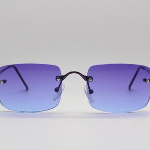 Y2K vintage frameless purple sunglasses. Dynamic graduation from purple to blue with matching metal arms. BNWT. NOS 90s