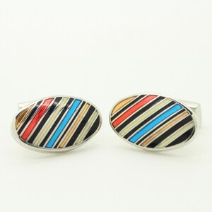 Thomas PInk vintage oval cuff links made in England. Solid metal construction with multi coloured diagonal stripes. NOS