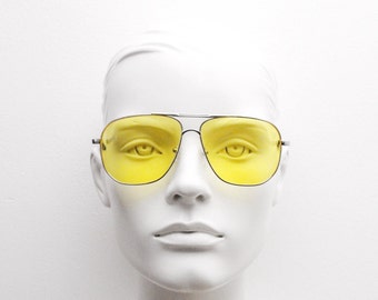 Yellow square aviator sunglasses. Silver double bridge metal frame with yellow shooter lenses. Mens 70s style aviators.