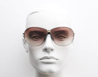Vintage 70s modified aviator sunglasses. Satin finish frame in optimum proportions with lethal light tone brown lenses. Men's aviators