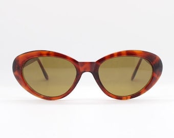 90s vintage oval cat eye sunglasses. NOS tortoise 50s style cateye with brown lenses. Rockabilly pin up cateyes. BNWT