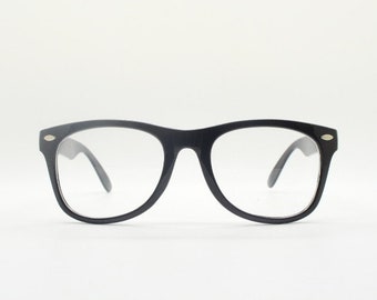 90s vintage wayfarer design glasses. All time classic black gloss optical frames. Prescription eyeglasses. Clear lens RX spectacles.