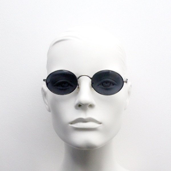 90s vintage oval sunglasses. Satin finish silver grey metal 20s style frame with embossed detailing. Unused NOS