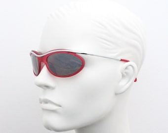 Y2K vintage red sunglasses. Suspended wraparound transparent red frame on chrome brow bar. BNWT. 2000s NOS