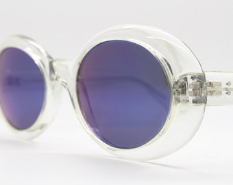 90s vintage oversized round sunglasses. Psychedelic transparent crystal frame with blue mirror lenses. NOS oval. Kurt Cobain clout goggles