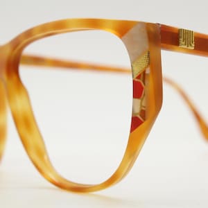 Lanvin Paris 80s vintage cat eye glasses. Mottled honey brown flat top optical frame with decorative sides. Prescription RX spectacles