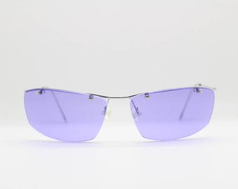 Y2K vintage dynamic vivd purple sunglasses. Stylised frameless floating lenses on metal browline. BNWT. 90s. 2000's Unworn NOS