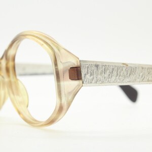 Metzler 60s vintage oval eye glasses made in the Germany. Womens transparent honey brown acetate optical frame with alloy arms. Spectacles